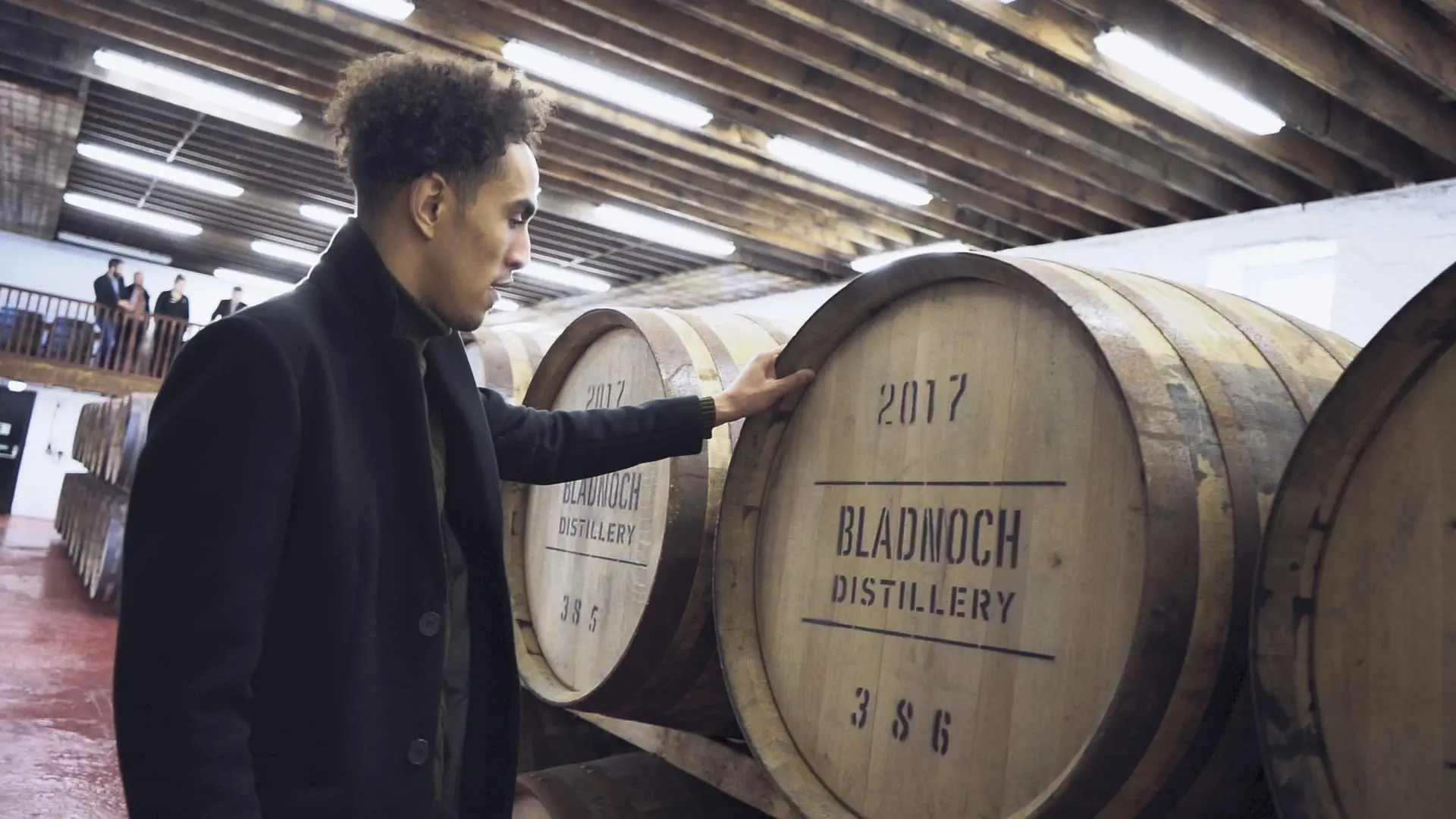 Whisky Investment, Investor in front of a Scottish Whisky Cask